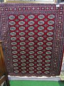 Red ground Bokhara carpet, 2.3 x 1.6. Estimate £90-110.