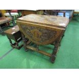 Small oak drop-side table with heavily carved top, turned & carved legs, 106cms (open) x 71cms.