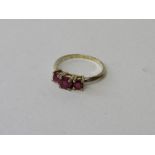 9ct gold ring with 3 rubies. Estimate £20-30.