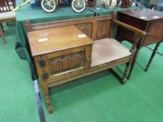 Oak hall telephone table & seat, 93cms x 46cms x 78cms. Estimate £30-40.