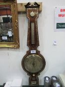 Rosewood & mother of pearl inlaid barometer/thermometer by Lowden of Dundee. Estimate £80-120.