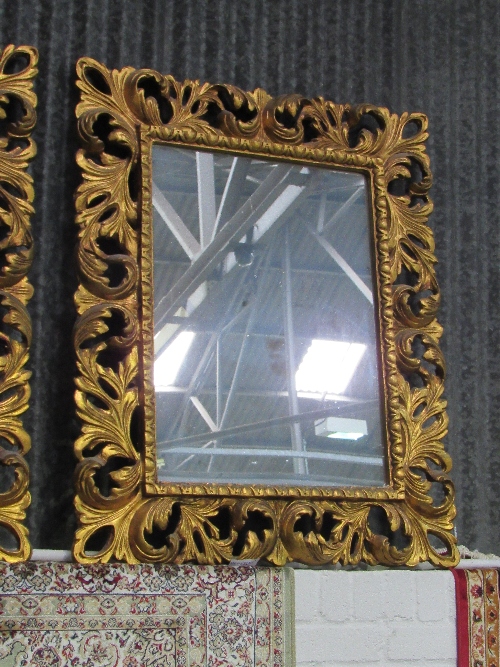 A pair of highly ornate carved foliage wall mirrors (mirror size 73cms x 52cms). Estimate £120-150. - Image 2 of 3
