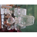 3 cut glass decanters, 1 with a silver label. Estimate £50-60.