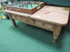 Pine coffee table with 3 frieze drawers, 122cms x 60cms x 49cms. Estimate £30-40.