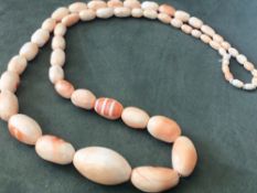 Angel skin coral necklace. Very substantial, highly polished, natural salmon pink, graduated coral