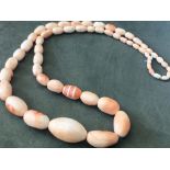 Angel skin coral necklace. Very substantial, highly polished, natural salmon pink, graduated coral