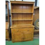 Pine dresser with 2 drawers over cupboard to base, 122cms x 47cms x 123cms. Estimate £50-80.