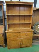 Pine dresser with 2 drawers over cupboard to base, 122cms x 47cms x 123cms. Estimate £50-80.