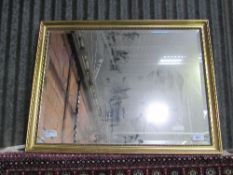 Gilt framed bevel edged mirror, 87cms x 112cms. Estimate £40-60.