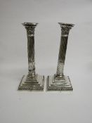 A pair of silver candlesticks by Hawksworth Eyre & Co Ltd, Sheffield, 1893 in the shape of