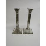 A pair of silver candlesticks by Hawksworth Eyre & Co Ltd, Sheffield, 1893 in the shape of