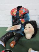 Geisha girl doll by Val Adams, 2001 (needs re-stringing). Estimate £30-50.
