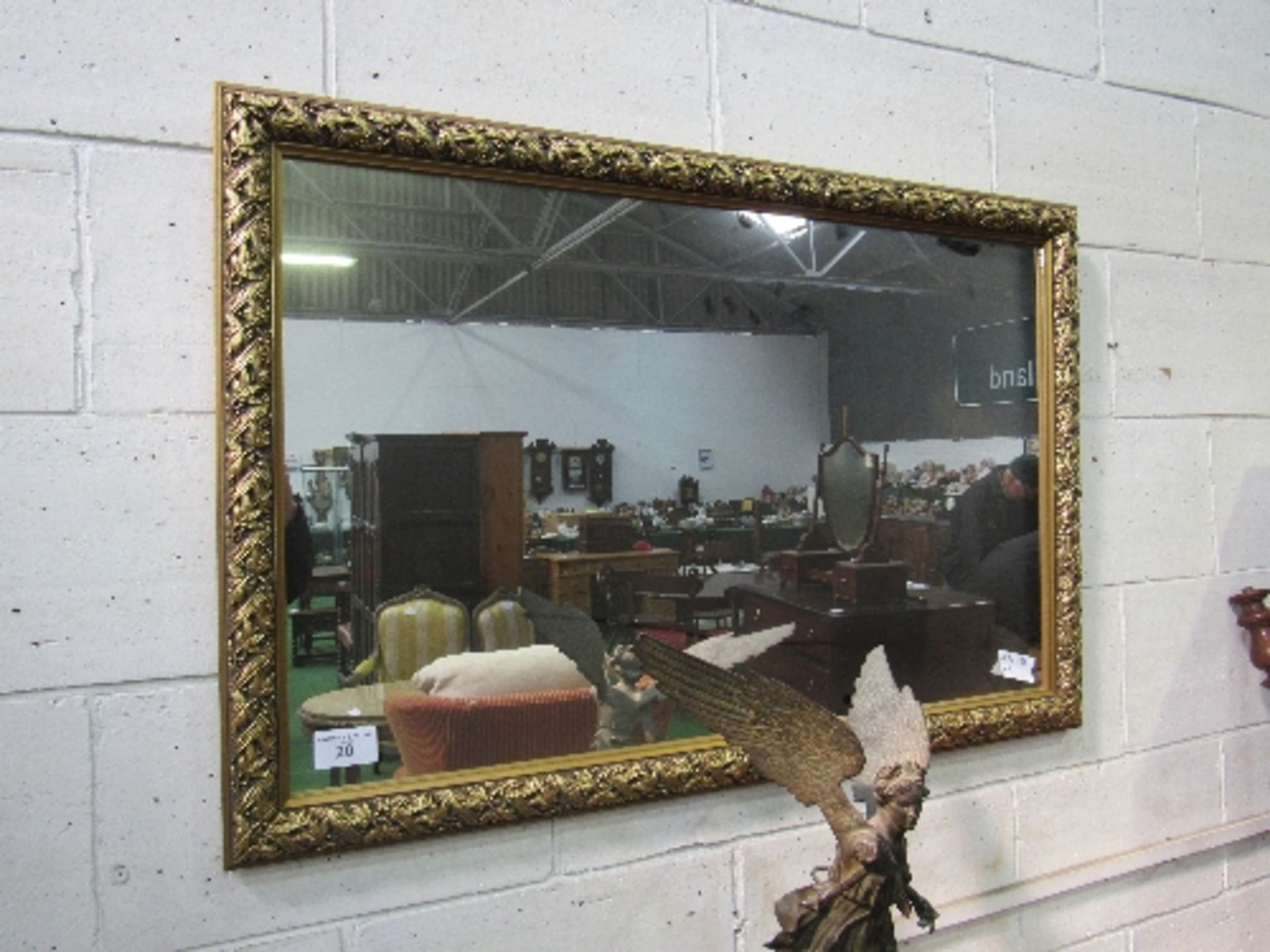 Gilt foliage framed wall mirror, 118cms x 78cms. Estimate £30-50.