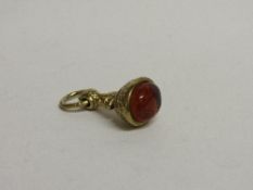 18ct (tested) gold & amber fob, total weight 14.9gms. Estimate £75-95.