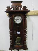 Mahogany Vienna wall clock with enamel dial, 115cms x 42cms. Estimate £20-40.