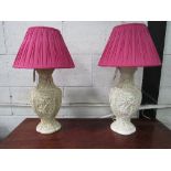 Pair of moulded lamp bases. Estimate £20-40.
