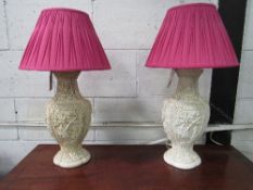 Pair of moulded lamp bases. Estimate £20-40.