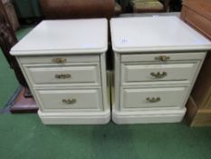 Pair of cream bedside cabinets with brush slides, 47cms x 47cms x 55cms. Estimate £10-20.