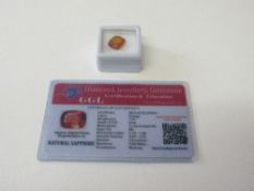 Natural orange sapphire, oval shape, weight 7.65ct, with certificate. Estimate £50-70.