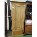 Pine wardrobe with drawer to base, 78cms x 43cms x 194cms. Estimate £20-40.
