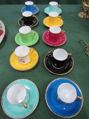 10 Tuscan coloured coffee cans & saucers. Estimate £20-30.