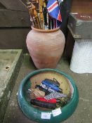 Large terracotta garden pot containing qty of sticks & umbrellas & a green glazed garden pot.