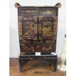 Oriental lacquer portable cabinet with ornate brass fittings, small compartment with sliding