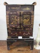 Oriental lacquer portable cabinet with ornate brass fittings, small compartment with sliding