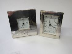 2 sterling silver mantle desk clocks. Estimate £35-55.