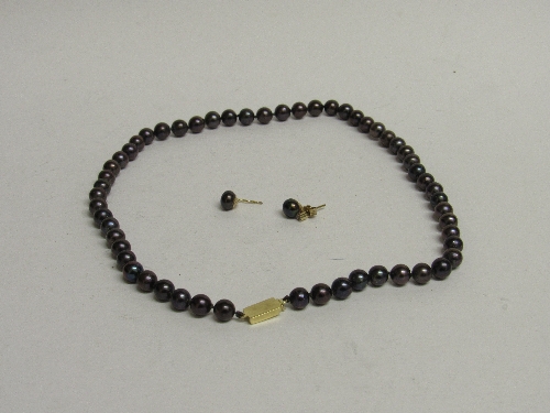 Necklace of lustre beads with an 18ct gold clasp & a pair of matching 9ct gold earrings. Estimate £