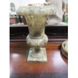 Onyx urn on a stand. Estimate £15-20.