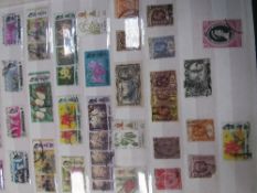 6 albums of postage stamps & postcards. Estimate £15-25.