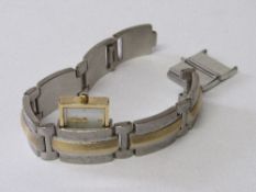 Fossil lady's slide-out watch with spare links. Estimate £10-20.