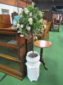 White ceramic jardinière on stand c/w artificial rose bush. Estimate £20-30.