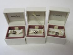 3 original retired Pandora silver charms. Estimate £25-35.