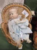 Reproduction 3-faced doll. Estimate £40-60.