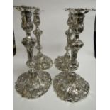 A set of 4 solid silver Georgian candlesticks by William Brown, London 1827, highly repousse