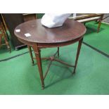 Circular mahogany table on tapered legs to casters, diameter 76cms. Estimate £10-20.