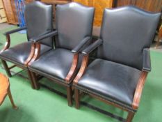 3 black leather-effect club-style open armchairs. Estimate £80-100.