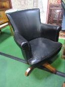 Vintage black leather upholstered swivel office chair. Estimate £30-50.