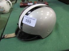 A vintage cork lined Everoak racing helmet. Estimate £100-150.