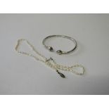 Silver coloured metal bangle & pearl necklace. Estimate £10-20.
