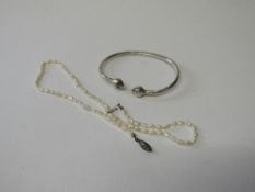 Silver coloured metal bangle & pearl necklace. Estimate £10-20.