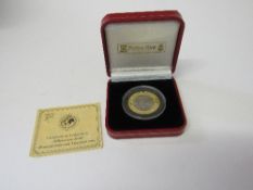 2000 Pobjoy Isle of Man gold/titanium half-crown. Estimate £220-250.