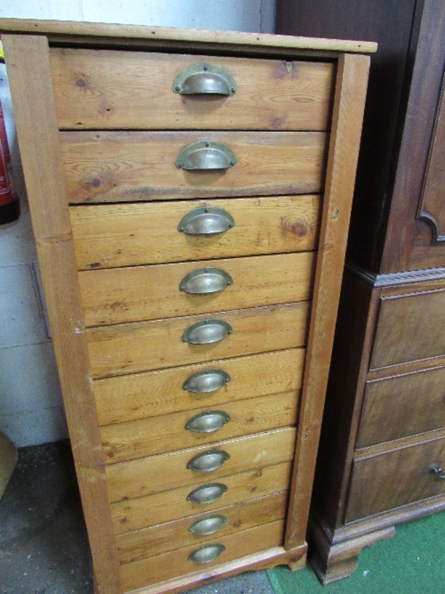 Antique pine Wellington-style tall chest of drawers, 55cms x 56cms x 125cms. Estimate £50-60.