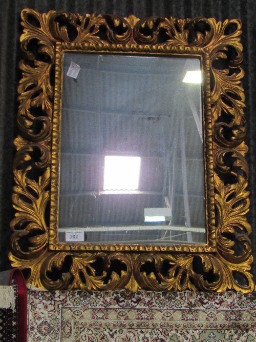 A pair of highly ornate carved foliage wall mirrors (mirror size 73cms x 52cms). Estimate £120-150. - Image 3 of 3