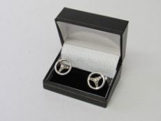 Murray Walker sterling silver cufflinks. Estimate £22-30.