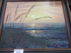 Framed oil on canvas of beach scene at sunset, signed C Robertson. Estimate £10-20.