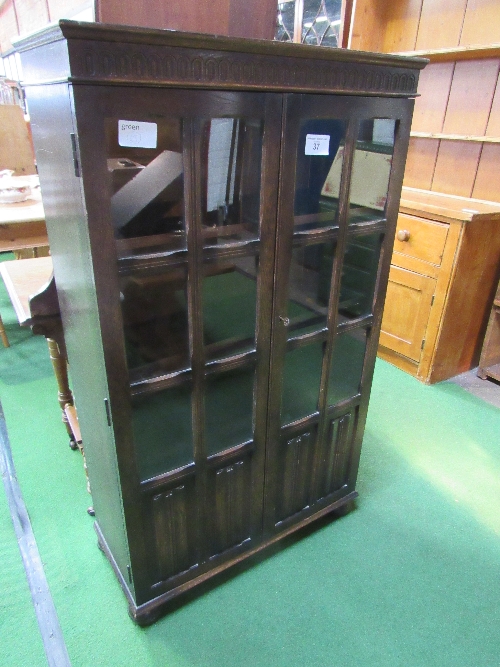 1930's style oak bookcase with glazed doors & linen fold panels, 79cms x 35cms x 136cms. Estimate £ - Image 2 of 2