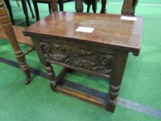 Dark oak small stool with rising lid & carved front, 46cms x 26cms x 42cms. Estimate £20-30.